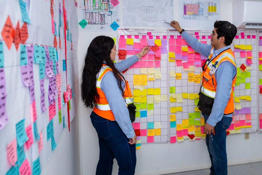 Construction planning team working on a work panel